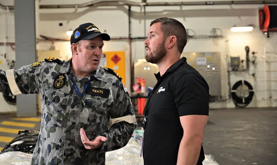 Team Downers Brad Thompson gets shown around HMAS Adelaide